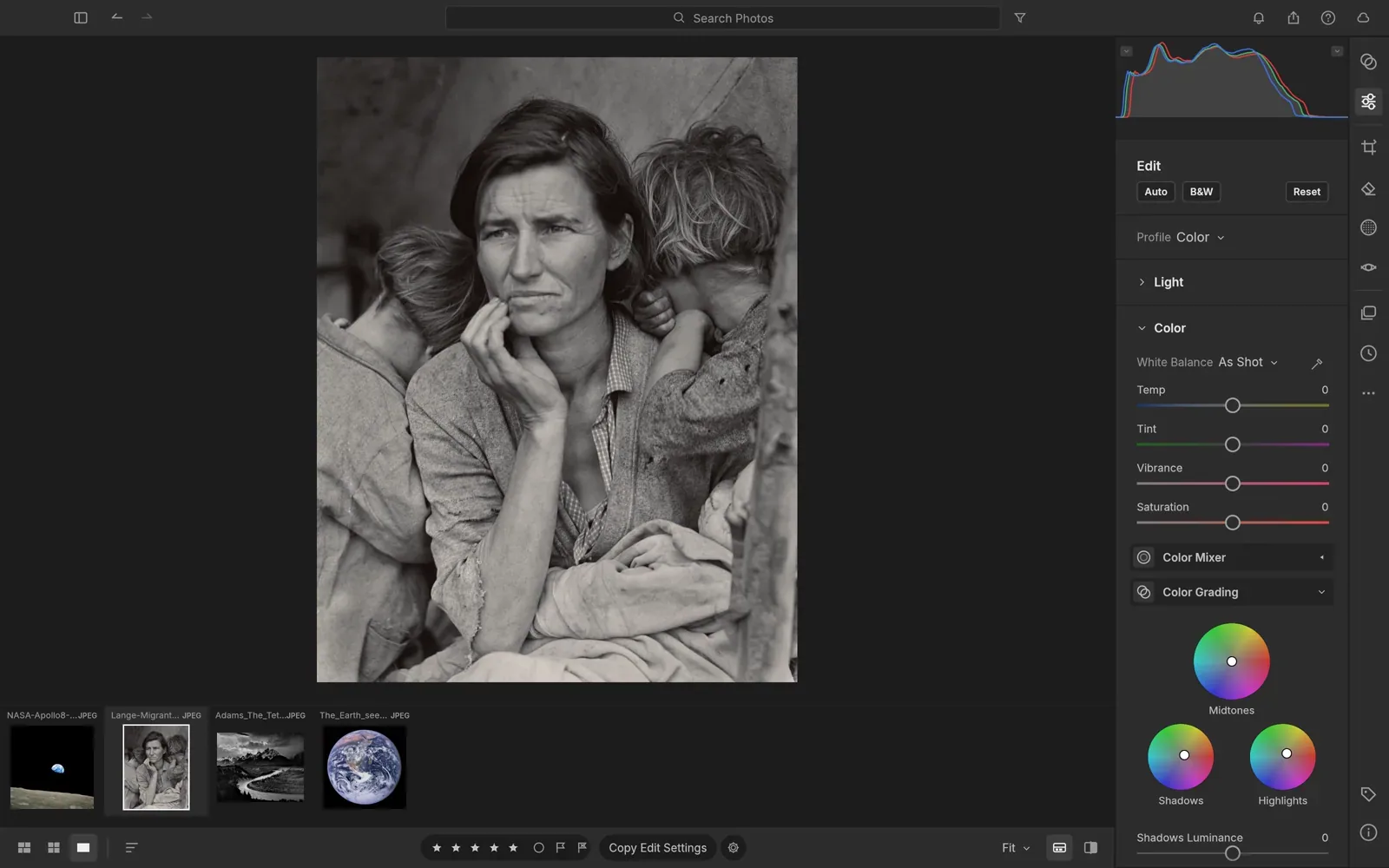 LightCraft's editing screen: a black-and-white portrait, with colour grading wheels and colour sliders on the right and a strip of photos below.